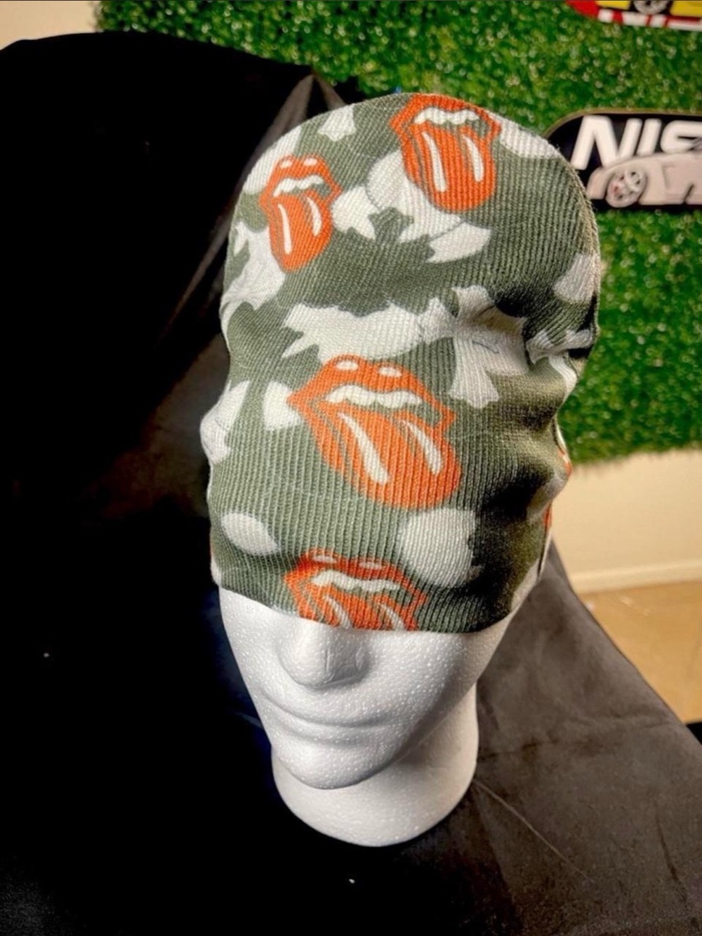 the Rolling Stones Camouflage Knit Beanie with Orange Tongue Motif